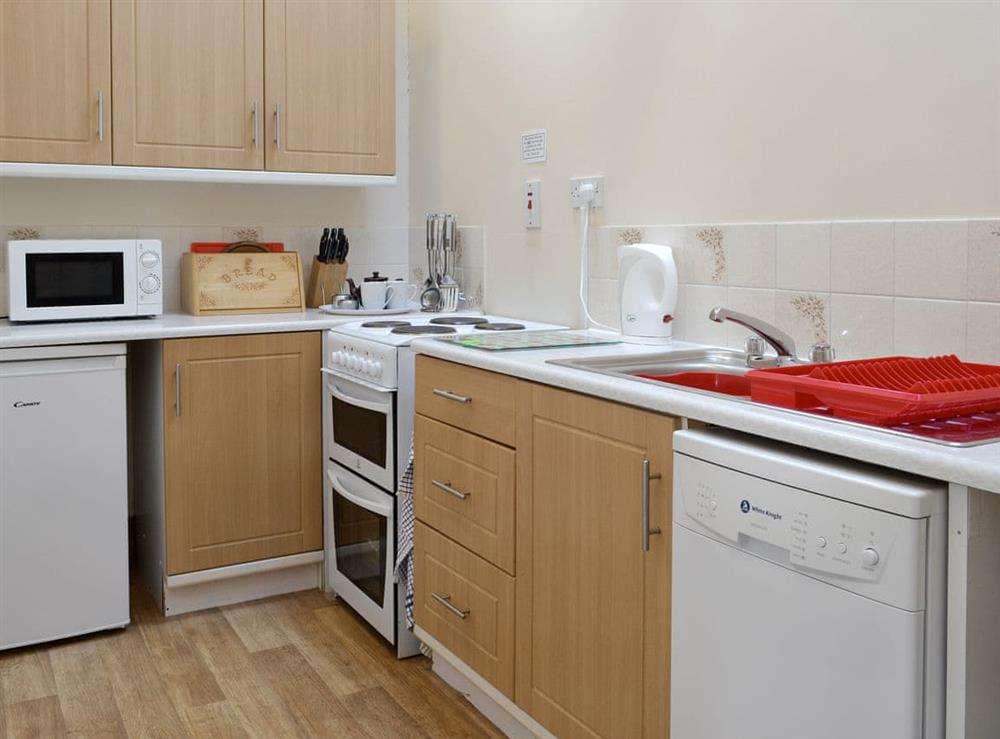 Well-equipped fitted kitchen at Halcyon Cottage, 