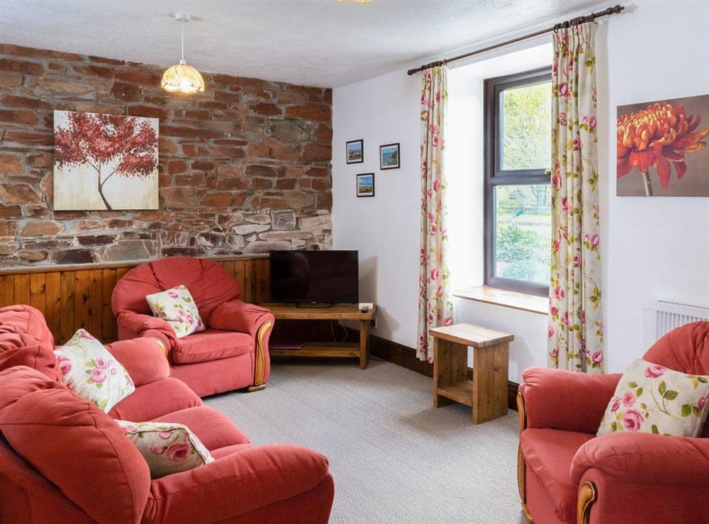 Delightful open plan living with exposed brick wall at Old Nog Cottage, 