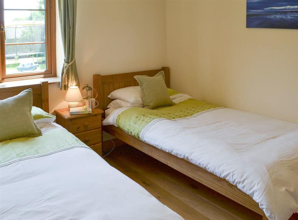 Good-sized twin bedroom at Tarkas Holt Log Cabin, 