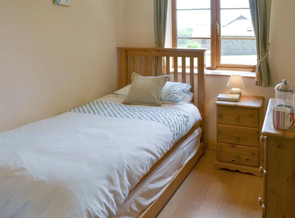 Peaceful single bedroom at Tarkas Holt Log Cabin, 