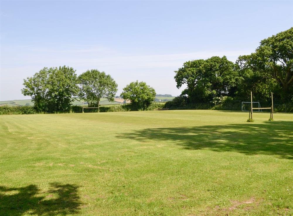 Well-maintained games field at Tarkas Holt Log Cabin, 