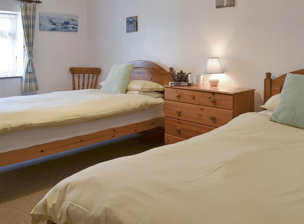 Comfortable twin bedroom at Tarquol Cottage, 