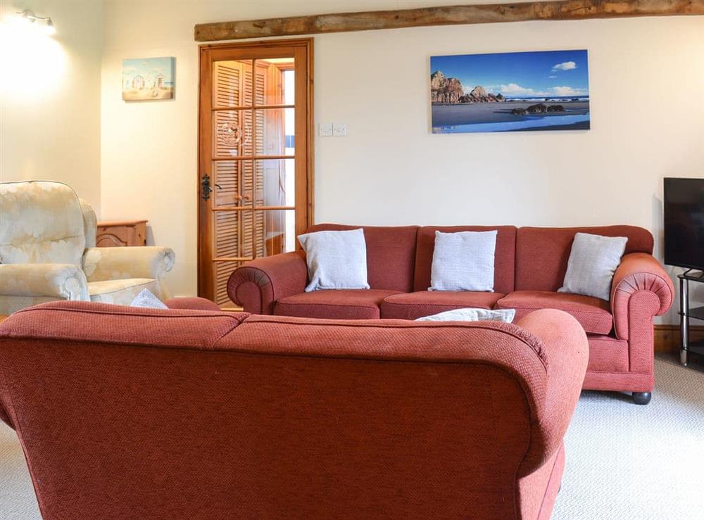 Cosy and comfortable open-plan living space at Warren Cottage, 