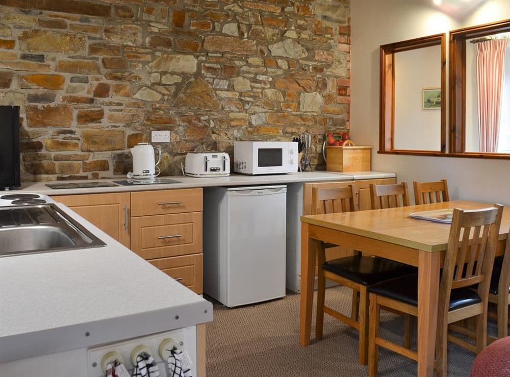 Well-equipped fitted kitchen at Warren Cottage, 