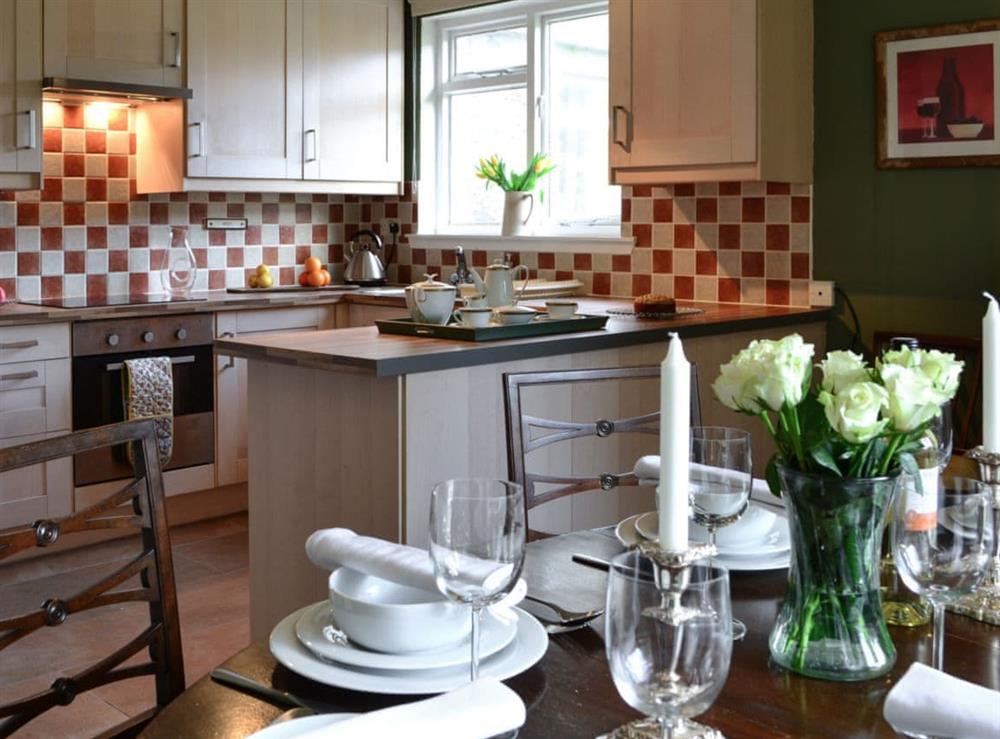 Dining area & kitchen at Strathcashel Cottage in Rowardennan, near Balamaha, Lanarkshire