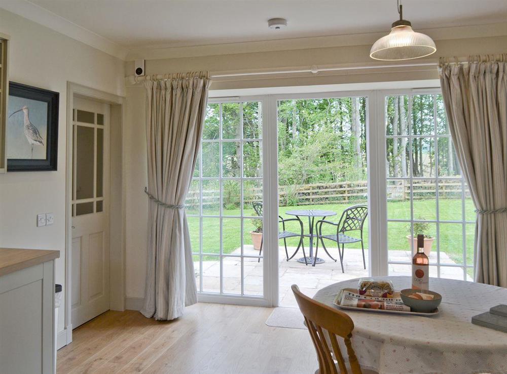 French doors from kitchen diner to sitting-out-area at Curlew Cottage, 