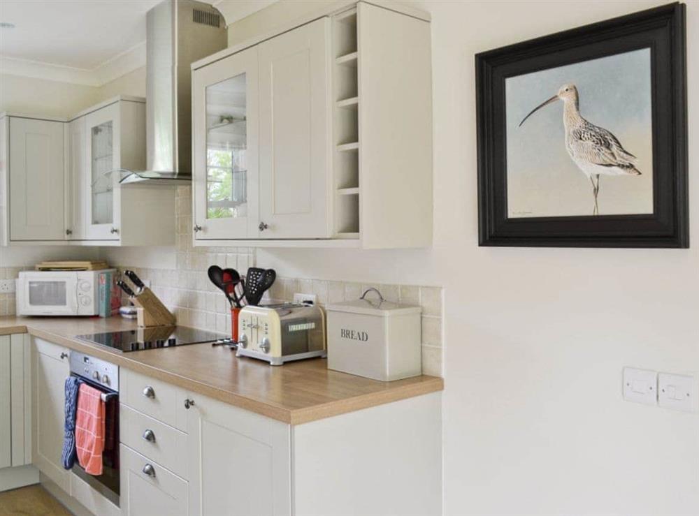Modern open plan kitchen in a traditional country style at Curlew Cottage, 