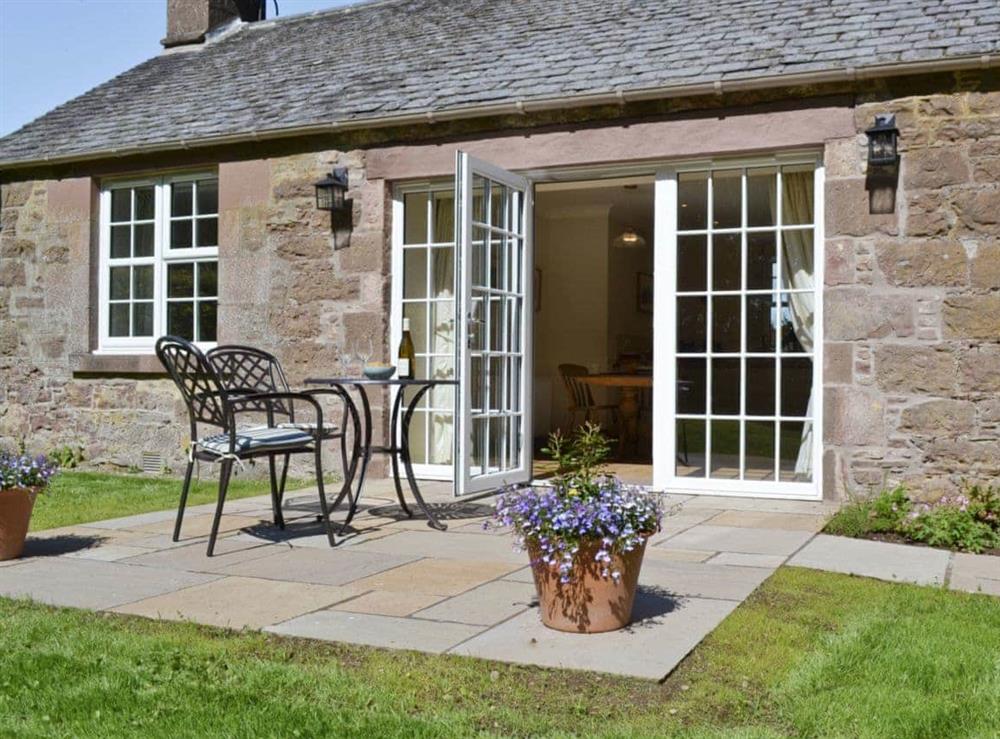 The patio area is perfect for relaxing at Curlew Cottage, 