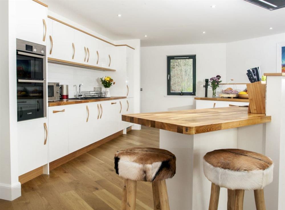 Fully-appointed kitchen with breakfast area at Strathspey Lodge in Duthil, Carrbridge, near Aviemore, Highlands, Inverness-Shire