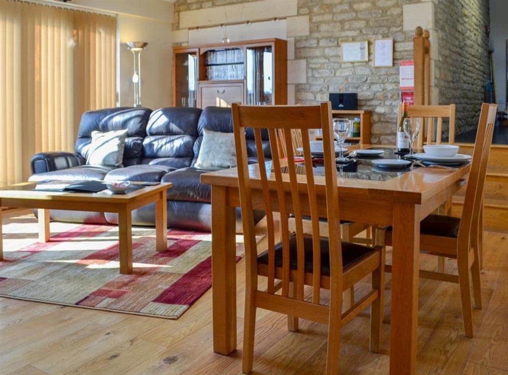Beautiful wood-floored living and dining area at Stratton Mill in Cirencester, Gloucester., Gloucestershire