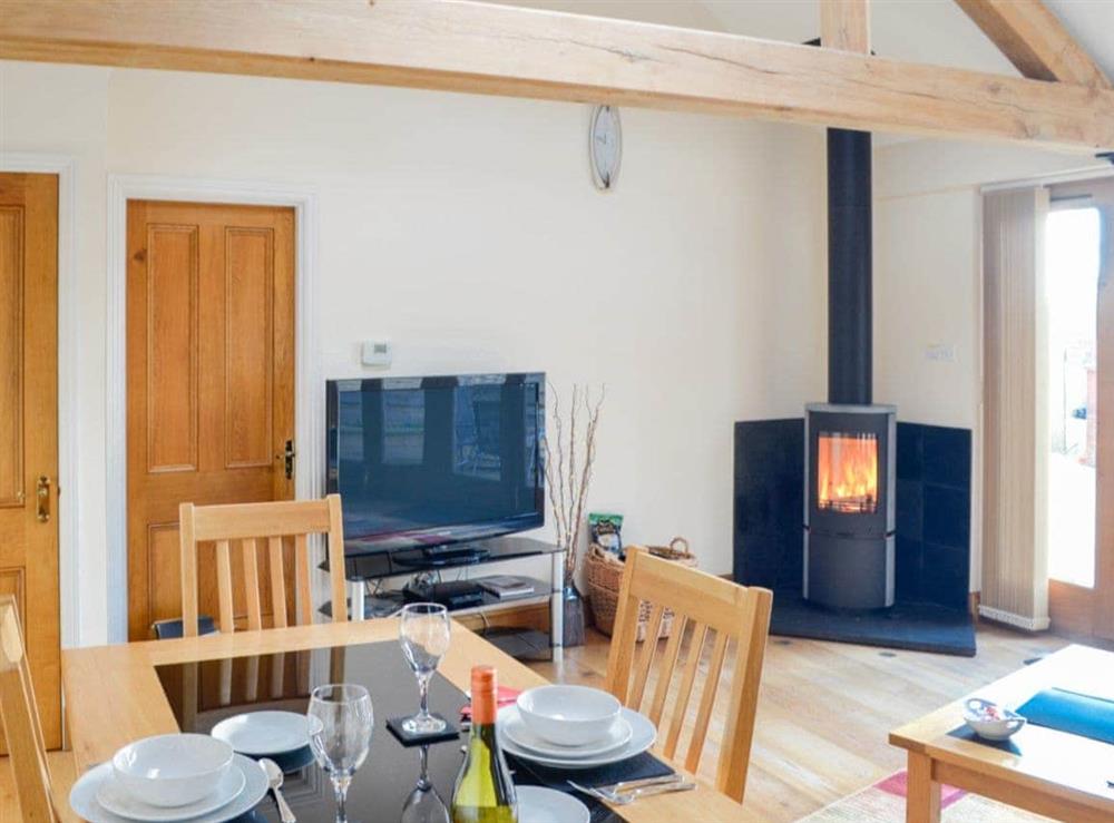 Cosy and comfortable living space with wood burner at Stratton Mill in Cirencester, Gloucester., Gloucestershire