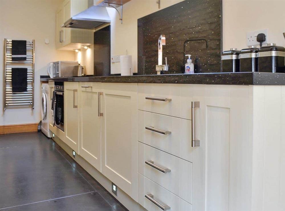 Well-appointed galley style kitchen at Stratton Mill in Cirencester, Gloucester., Gloucestershire