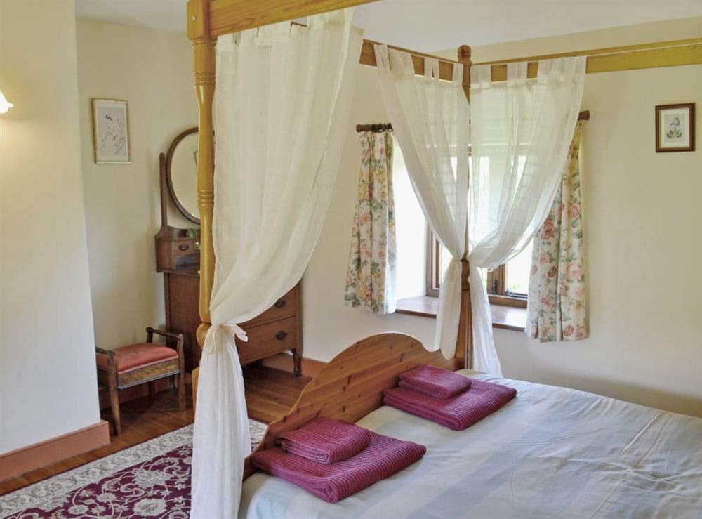 Four Poster bedroom (photo 2) at Strawberie Cottage in Beaminster, Dorset