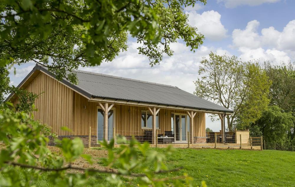 This larch clad, single storey property boasts a beautiful veranda commanding breath-taking views of rolling countryside