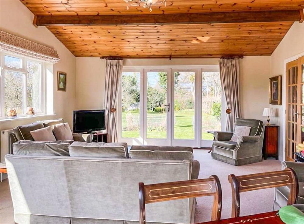 Living room at Strood Park Farmhouse in Warnham, near Horsham, West Sussex