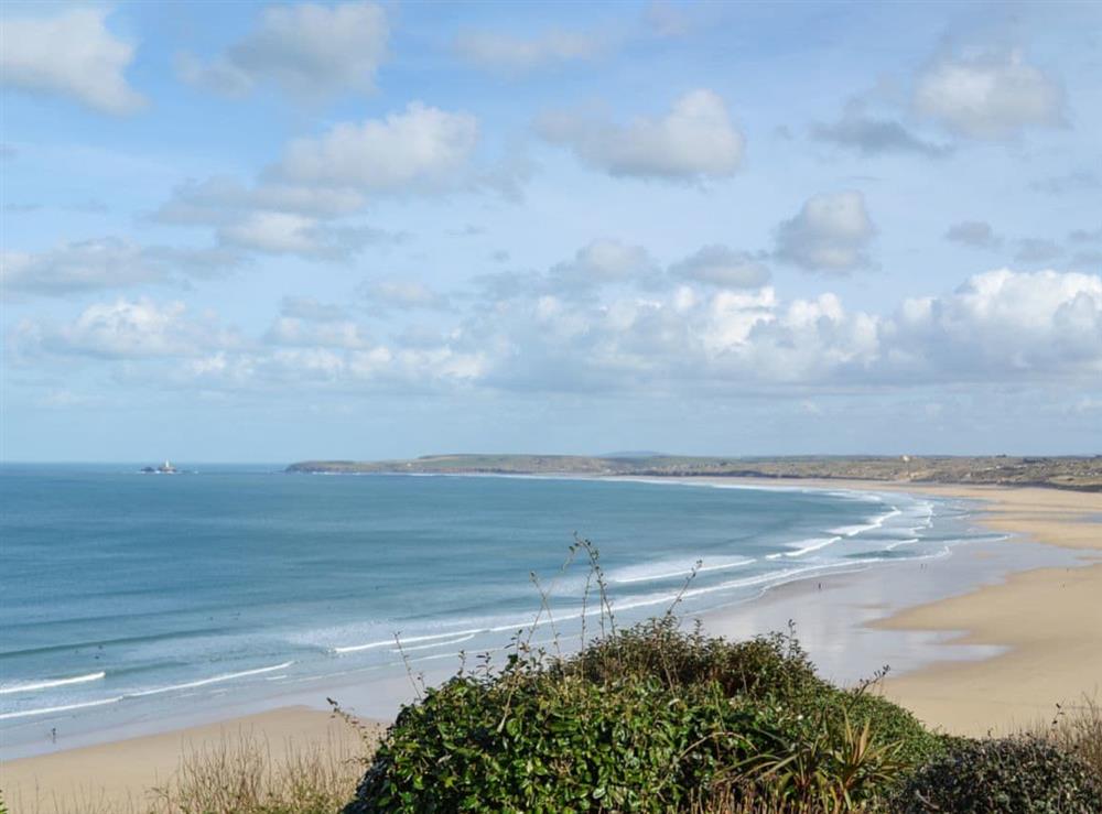 A wonderful view over Gwithian Towans and Godrevy beaches to Godrevy Point and the lighthouse at Studio Sea Urchin in Carbis Bay, near St Ives, Cornwall