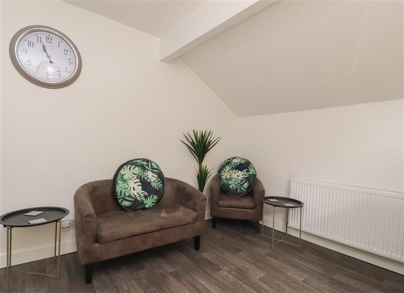 Relax in the living area at Suite 14, Blackpool