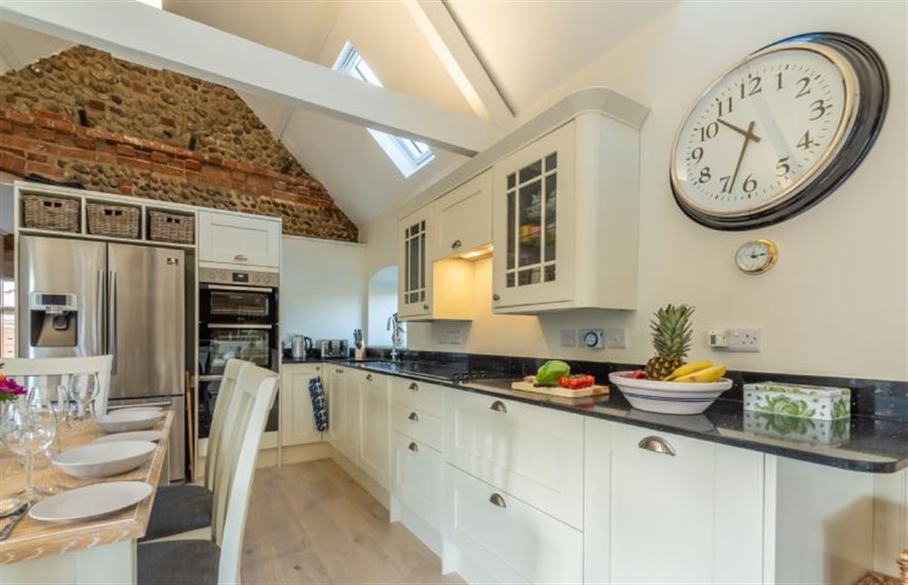 Ground floor: A well-equipped galley-style kitchen at Summer Barn, Weybourne near Holt