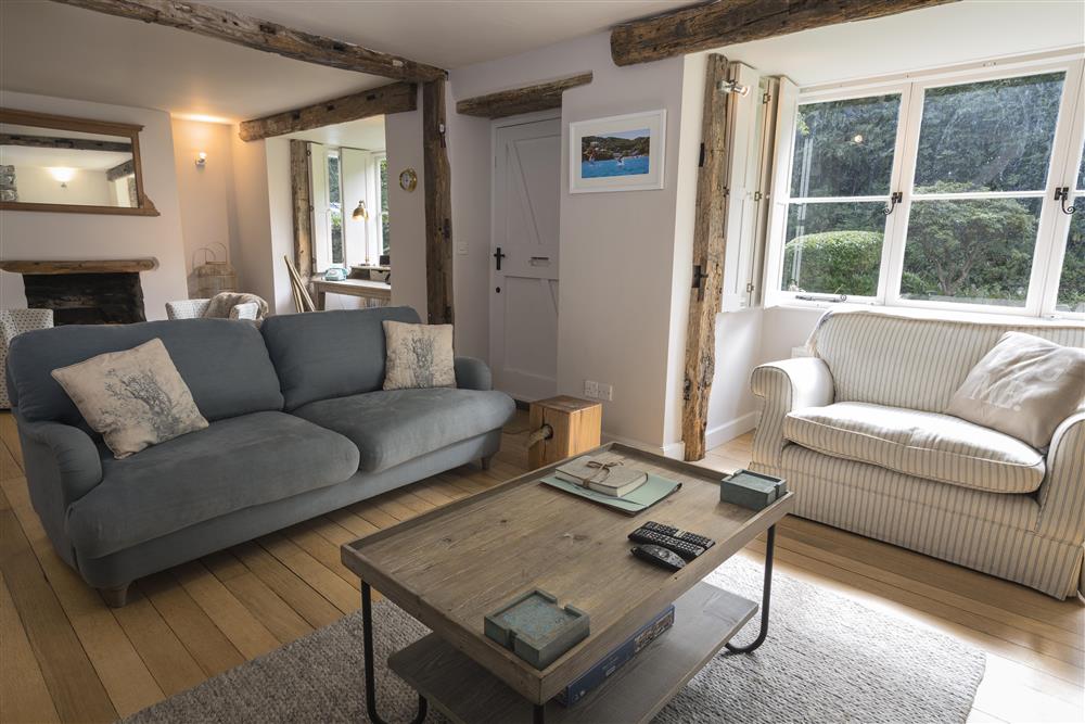 Entrance into a charming and cosy sitting room at Summer Cottage in , Salcombe
