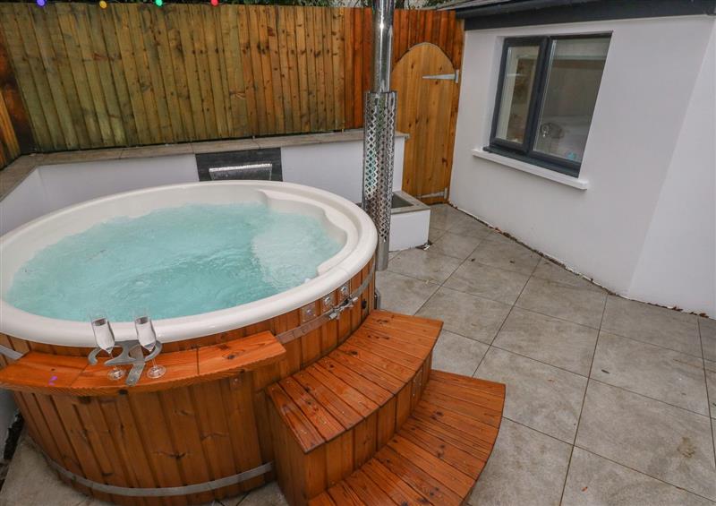 Relax in the hot tub at Summer House, Penally