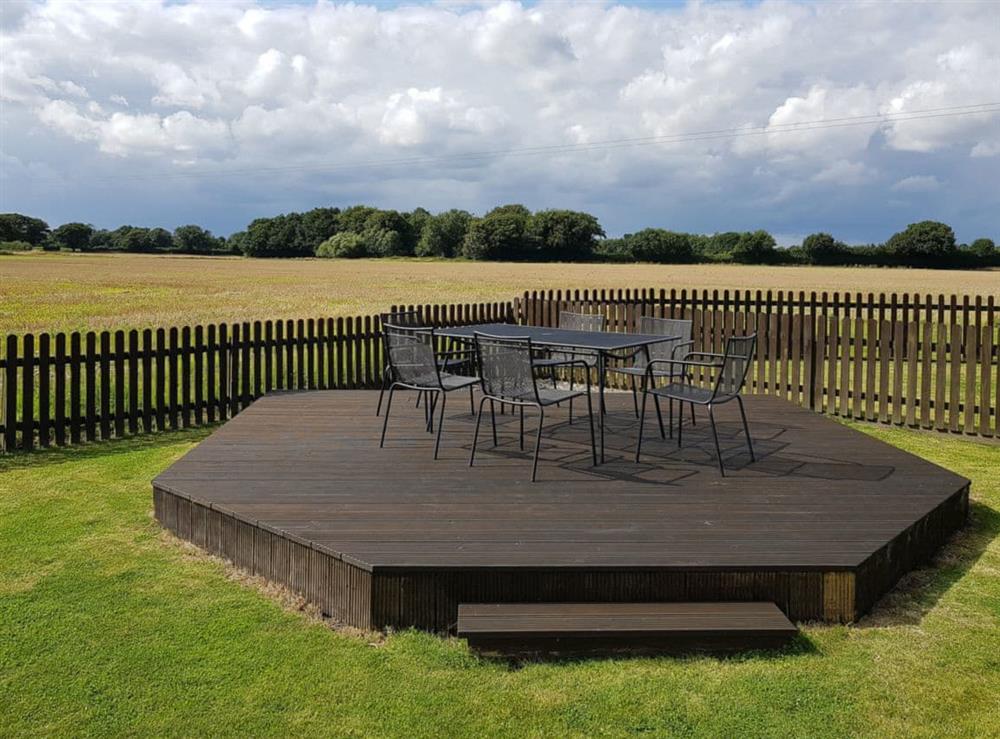 Raised decked area with open views over the countryside at Summer House Stables in Catfield, near Stalham, Norfolk