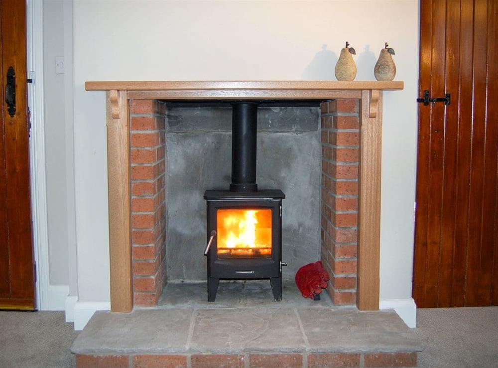 Cosy living/dining room with wood burner (photo 2) at Summergate Cottage in Annan, Dumfriesshire
