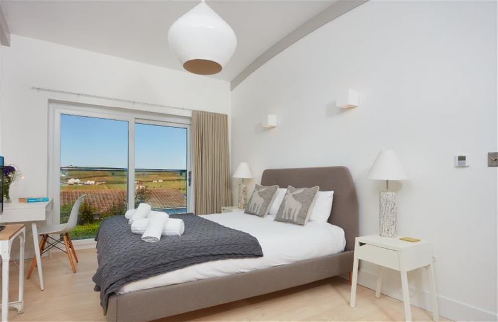Sundown, Cornwall: Bedroom one on the first floor with a king-size bed and Juliet balcony. Wake up to stunning views