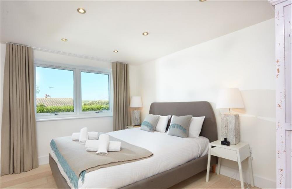 Sundown, Cornwall: Bedroom three on the ground floor with a king-size bed at Sundown, Bude