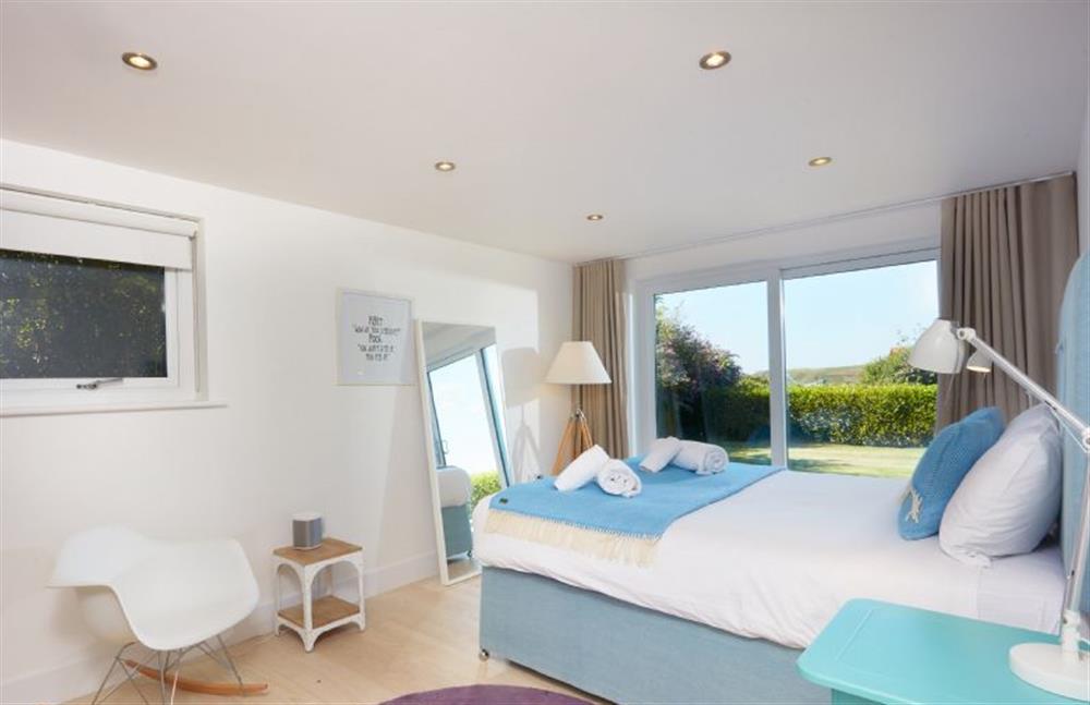 Sundown, Cornwall: Bedroom two with a king-size bed and en-suite shower room. at Sundown, Bude