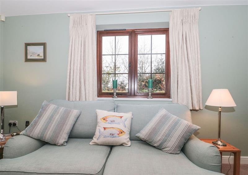 Relax in the living area at Sundowner Cottage, Axminster