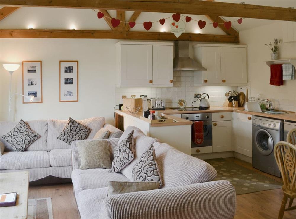 Open plan living space at Sunflower Holiday Cottage in Thoresthorpe, near Alford, Lincolnshire