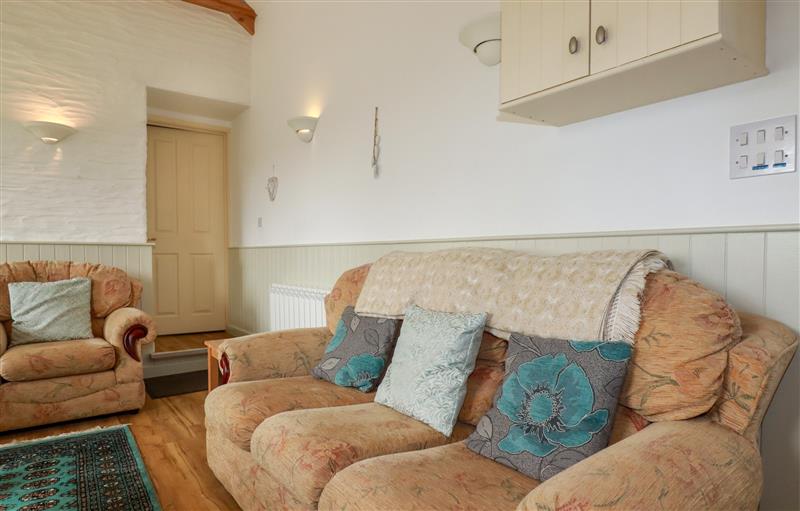 Relax in the living area at Sunlight Cottage, Truro
