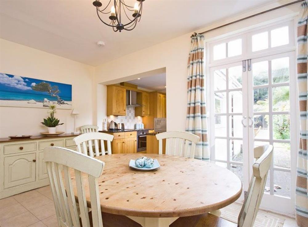 Dining area with french doors onto terrace at Sunnidale in Salcombe, Devon