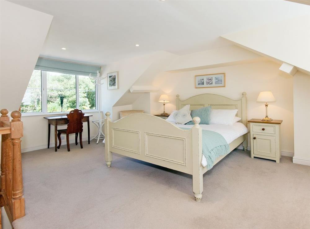 Large attic bedroom with kingsize bed at Sunnidale in Salcombe, Devon