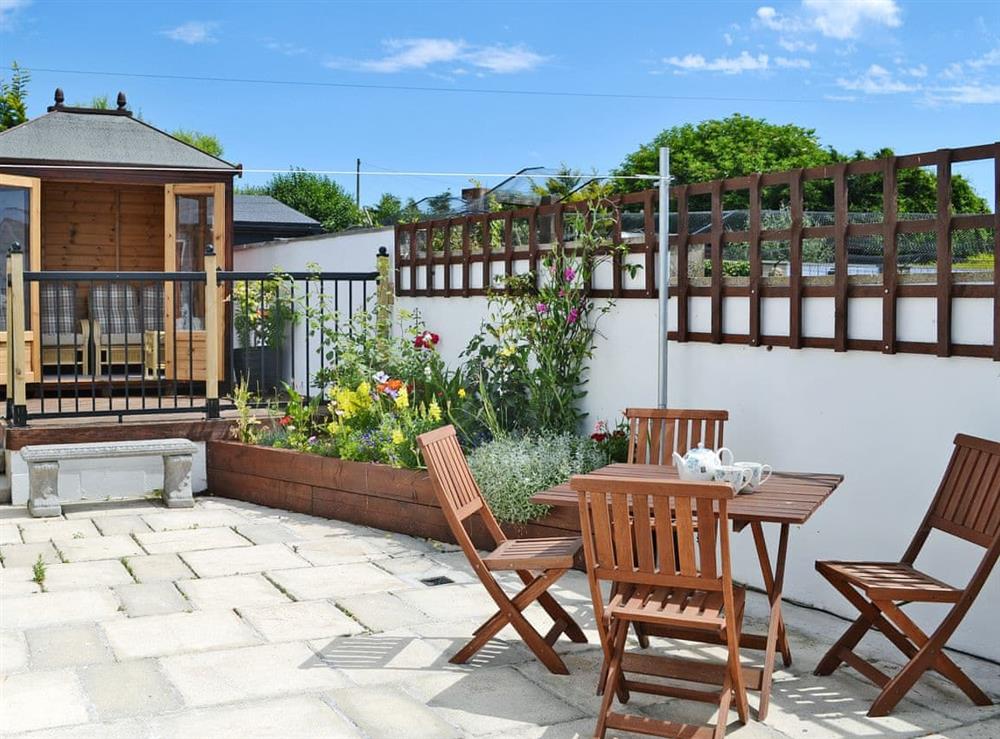 Relaxing outdoor area with summerhouse at Sunny Bank in Bude, Cornwall