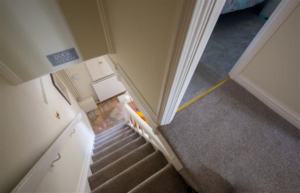 Ground floor: The stairwell is steep with a low ceiling - mind your head! at Sunny Beck Cottage, Mundesley near Norwich