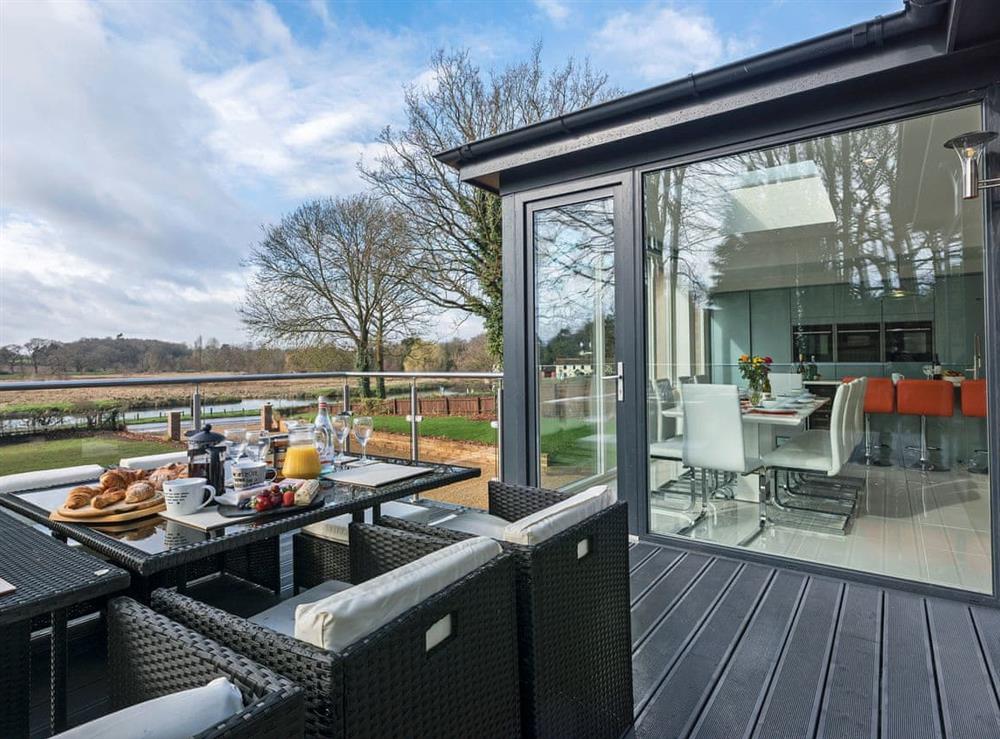 Large glass veranda boasting beautiful views at Sunnybank in Coltishall, near Wroxham, Norfolk, England