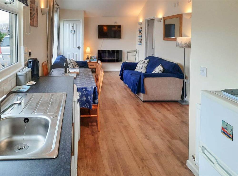 Open plan living space at Sunnydaze Chalet in Dartmouth, Devon