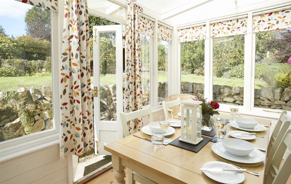 The dining room overlooking the beautiful garden at Sunnylea Cottage, Great Longstone