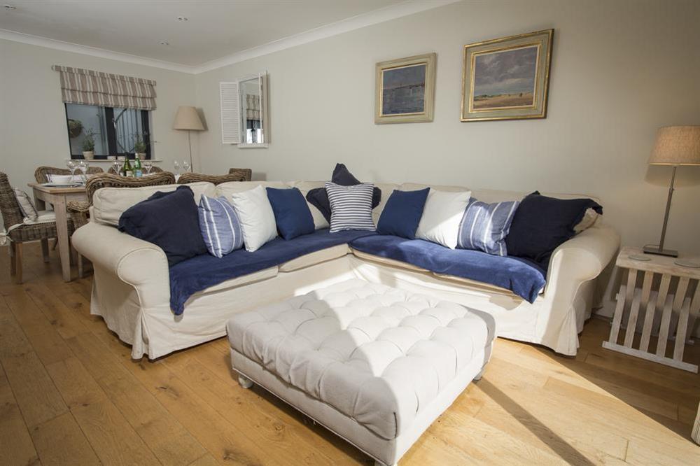 Lounge with large comfortable sofas and doors leading out to the terrace at Sunnylodge in , Salcombe