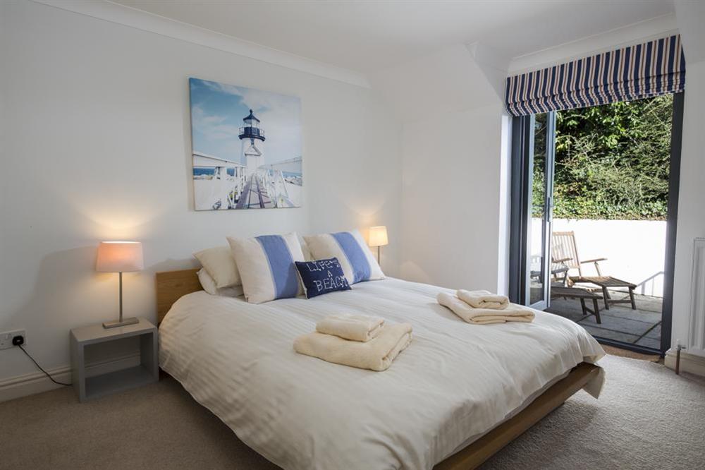 Second bedroom with door to the terrace at Sunnylodge in , Salcombe