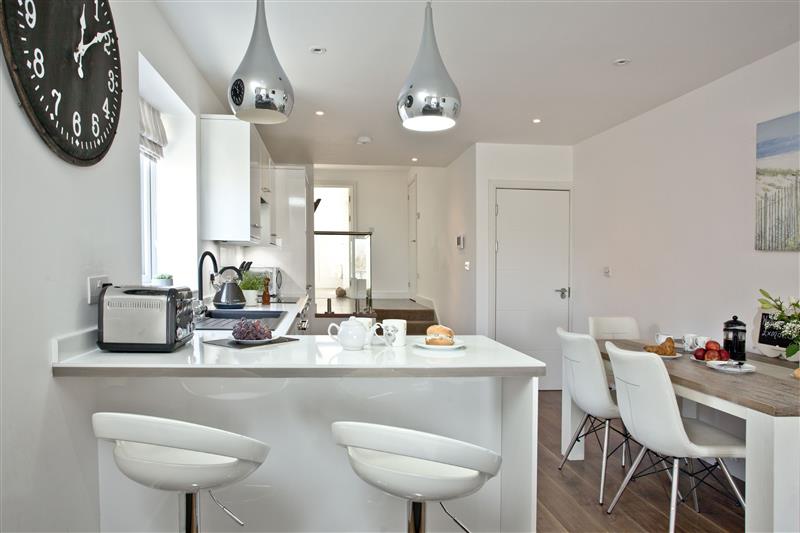 The kitchen and dining area at Sunnymead Penthouse, Exmouth, Devon