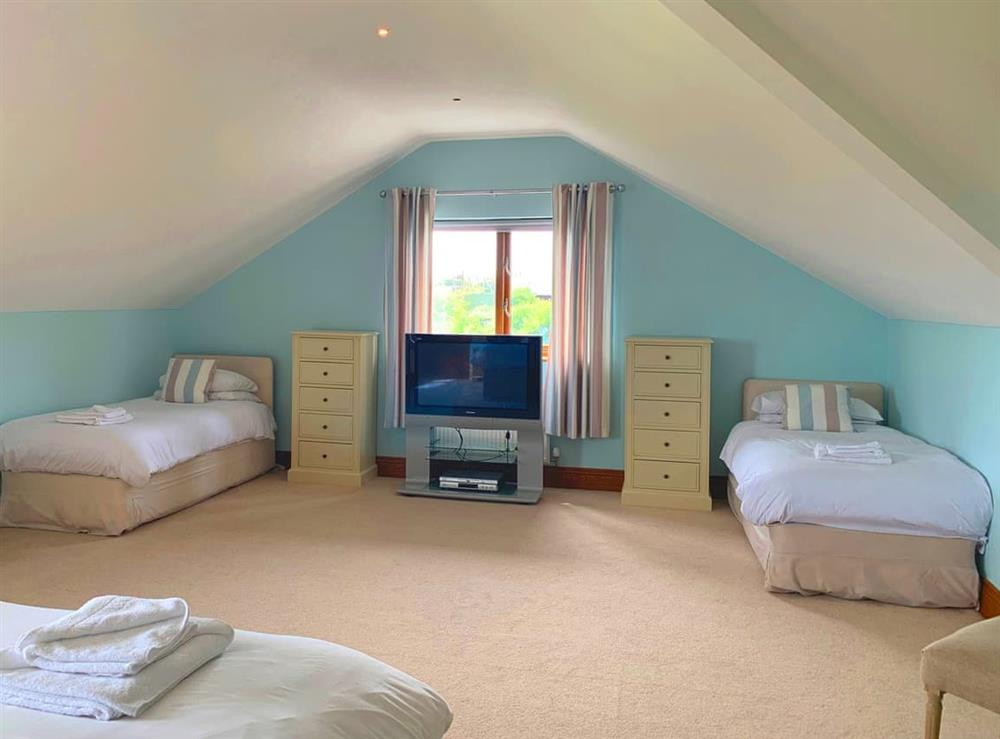 Spacious bedroom with kingsize bed and twin beds (photo 2) at Sunnymeade in Stainton with Adgarley, near Dalton-in-Funess, Cumbria
