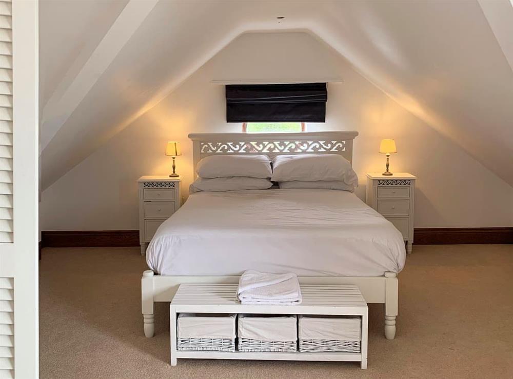 Spacious bedroom with two kingsize beds at Sunnymeade in Stainton with Adgarley, near Dalton-in-Funess, Cumbria