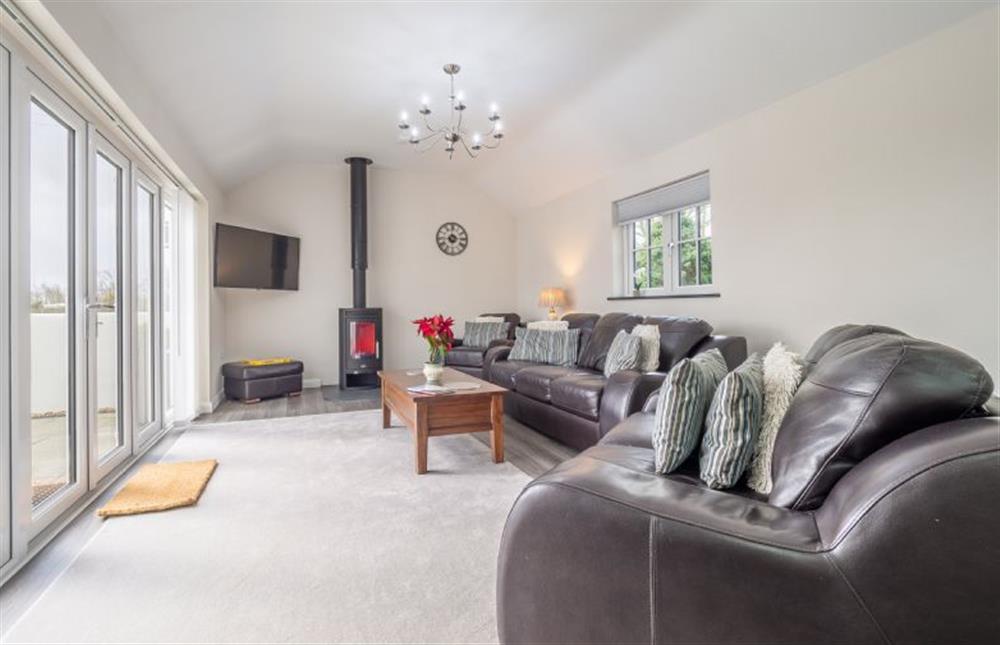 Spacious sitting room with wood burning stove at Sunnyside Barn, Chacewater Truro