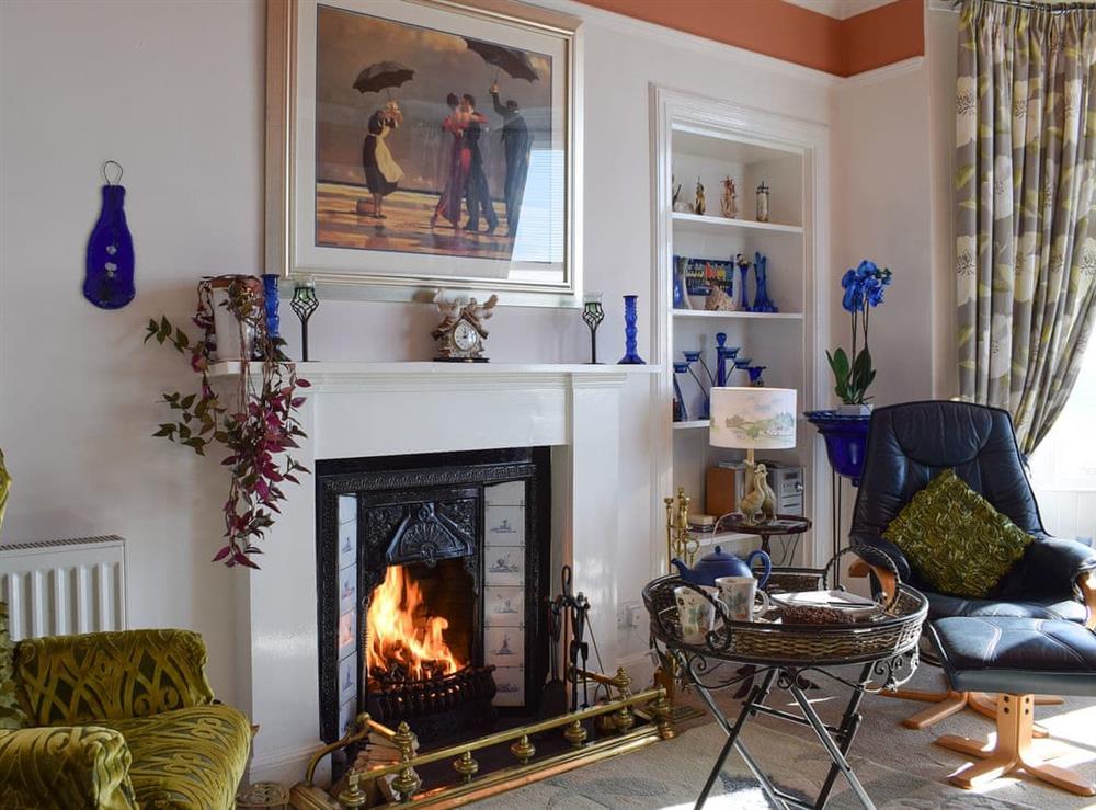 Living room with cosy open fire at Sunnyside Beach in Lower Largo, Fife