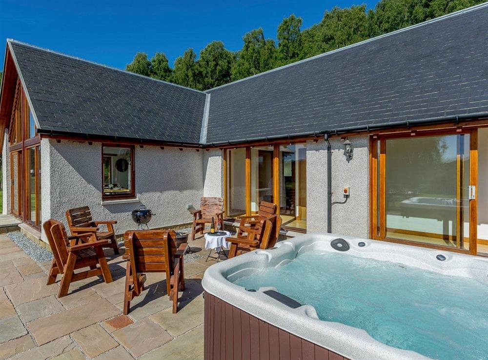 Inviting, private hot tub (photo 2) at Sunnyside House in Carrbridge, near Aviemore, Inverness-Shire