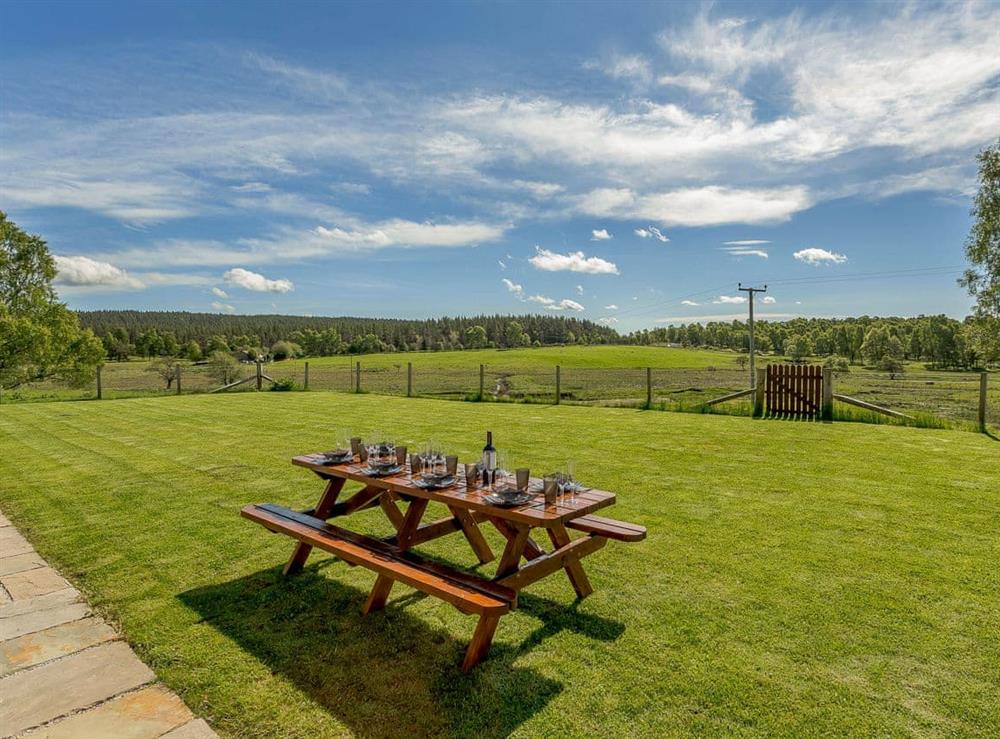 Large lawned garden with stunning views at Sunnyside House in Carrbridge, near Aviemore, Inverness-Shire