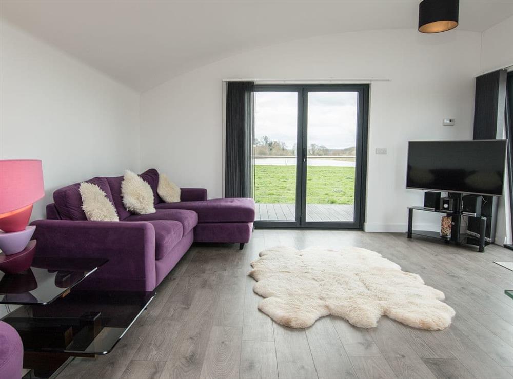Open plan living space at Sunnyside Lodge in Sharpham, near Glastonbury, Somerset