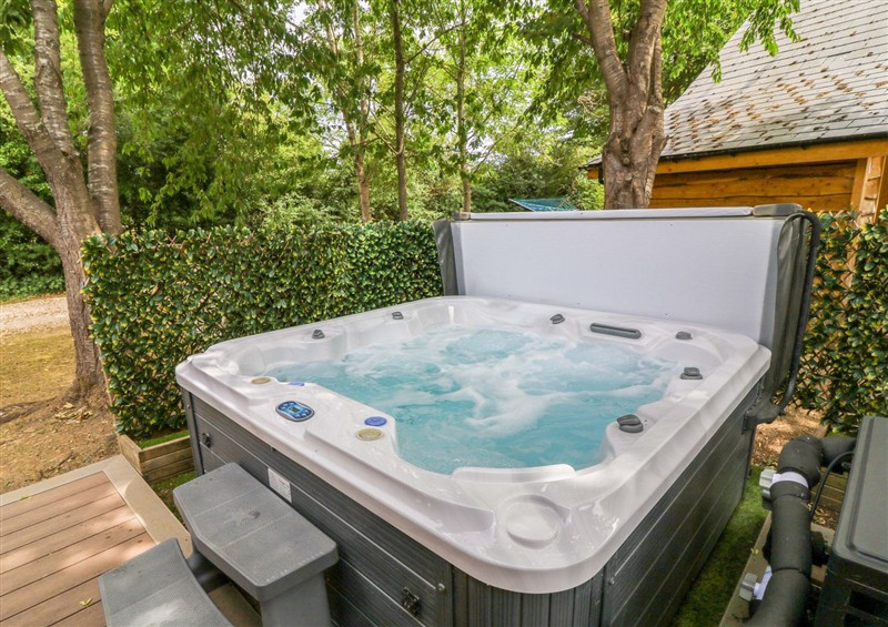 Relax in the hot tub at Sunnyside Lodge, Thorpe-On-The-Hill
